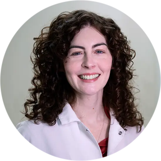 Home 7 Professional portrait of curly-haired dentist – Reconstructive Dentistry in Westbury, NY – Smallberg & Satornino, DDS, PLLC